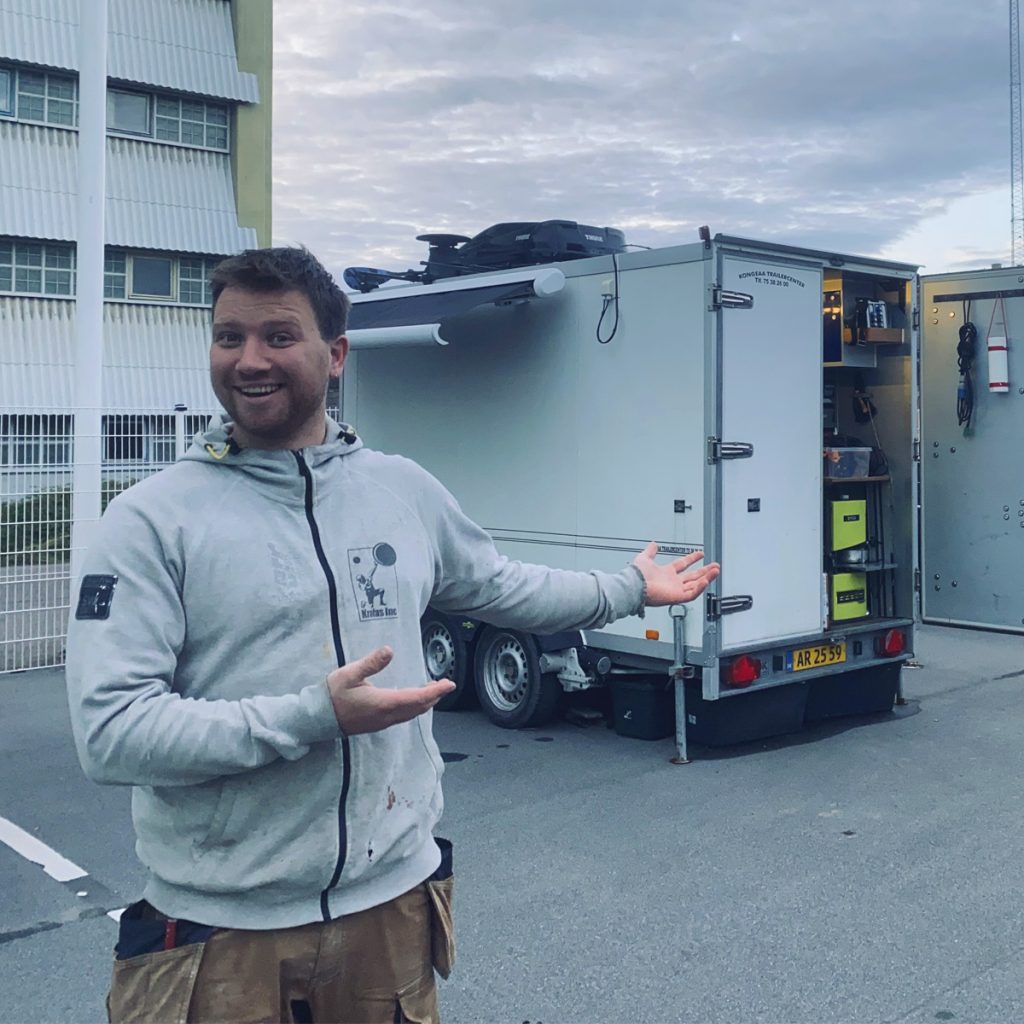 Lasse Kromann in front of his trailer